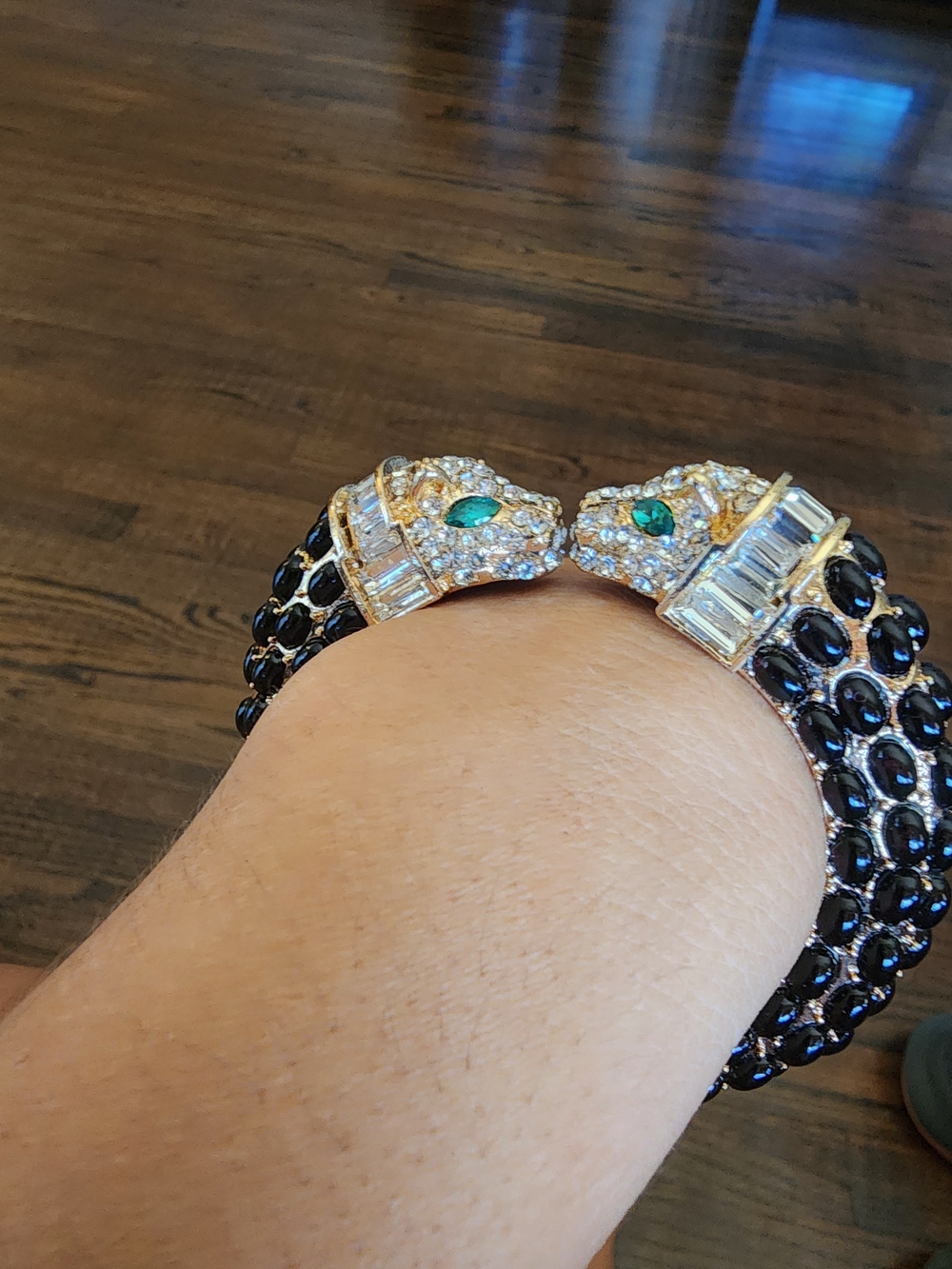 Gold-Tone Panther Cuff Bracelet with Black Beading and Green Eyes